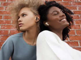 Two women wearing House of Marley Rebel true wireless earbuds