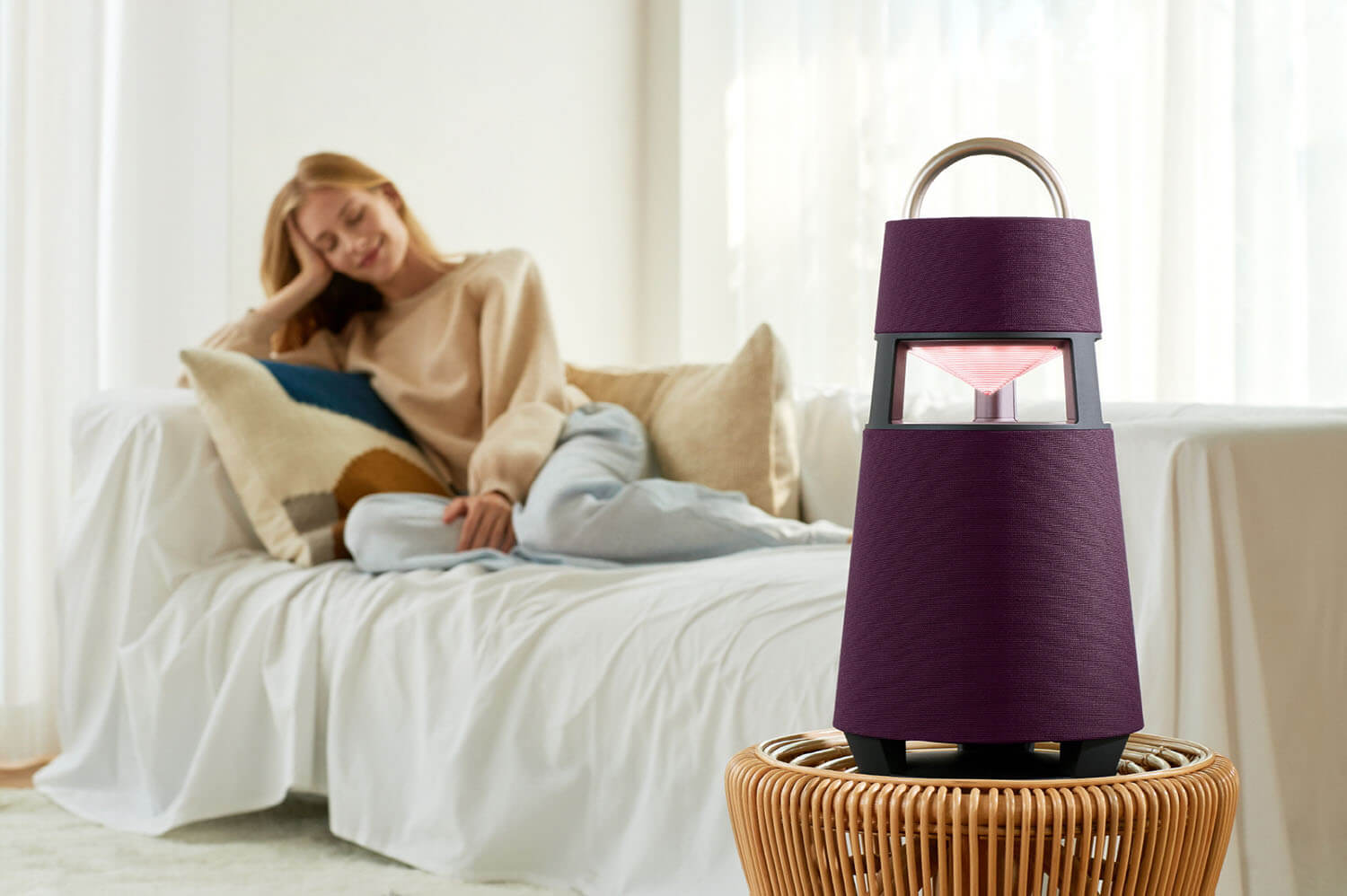 LG XBOOM 360 wireless speaker in the bedroom.