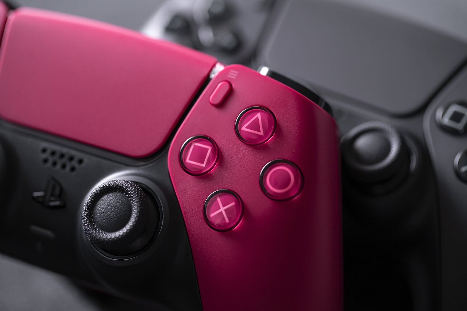 Sony PlayStation DualSense gaming controller in cosmic red