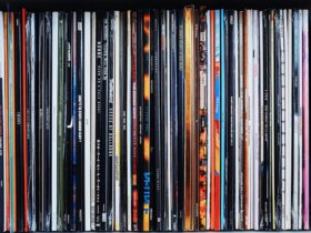 Vinyl records in a row on a shelf