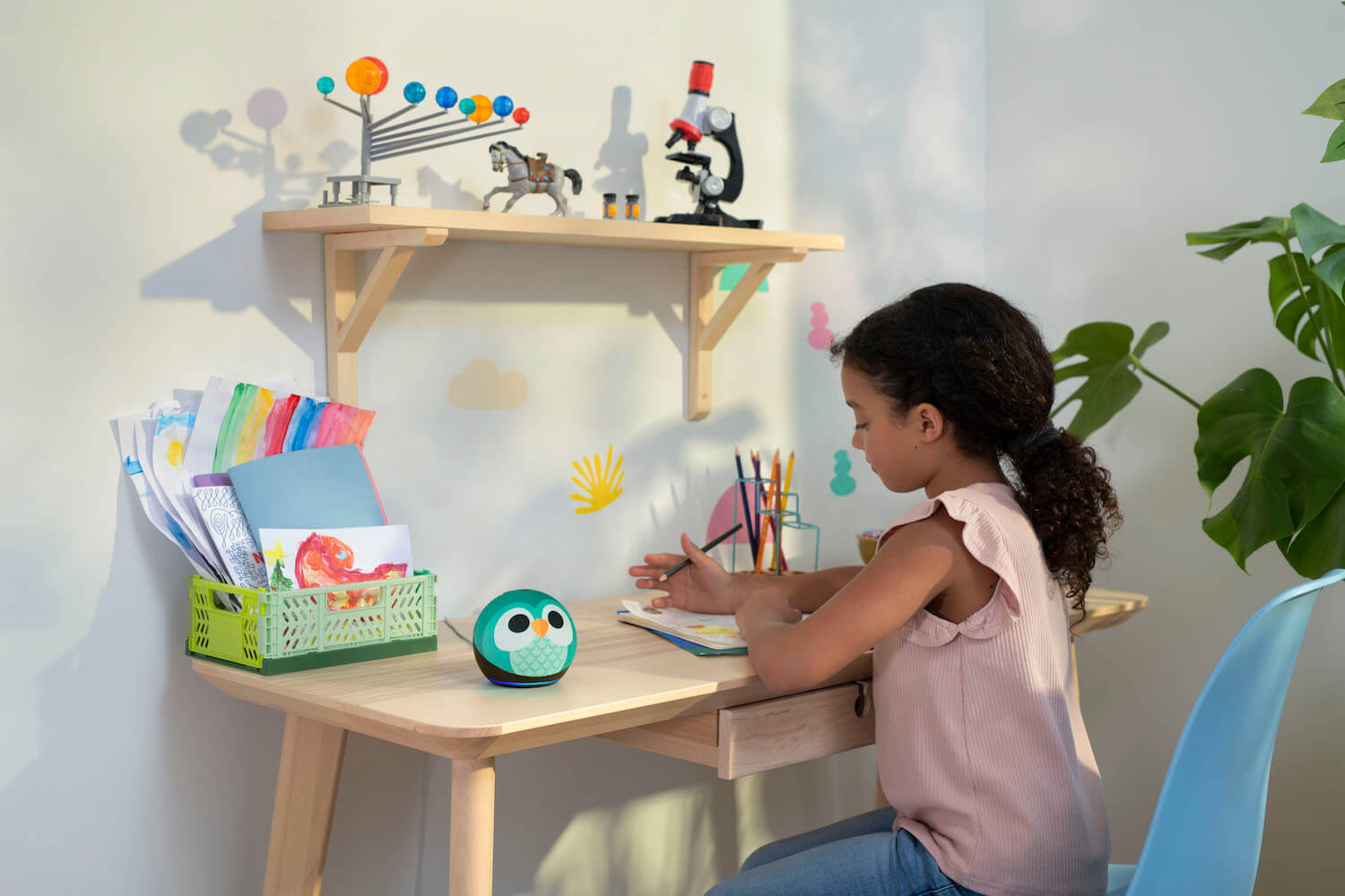 Girl at her desk with Amazon Echo Dot Kids