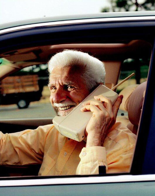 Dr. Martin Cooper on cell phone in car.