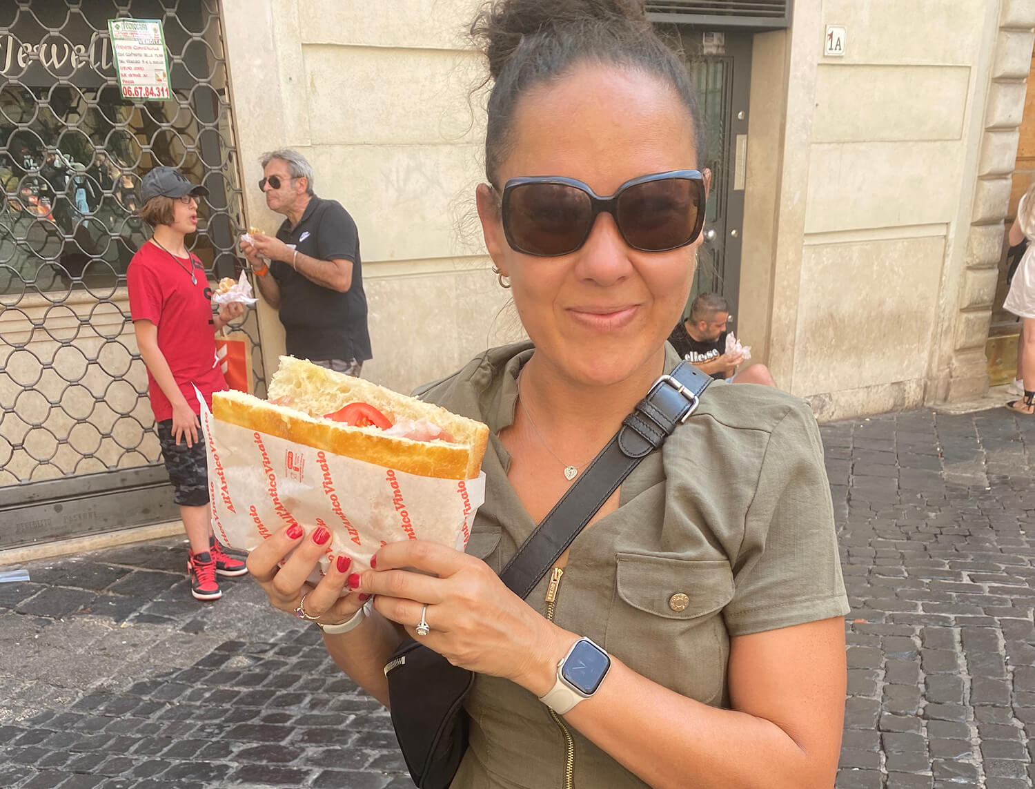 Holding a sandwich with an Apple Watch