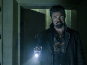 Billy Butcher holding a flashlight in the dark in a scene from Gen V.