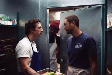 Carmy and Richie look angrily at one another in a scene from The Bear