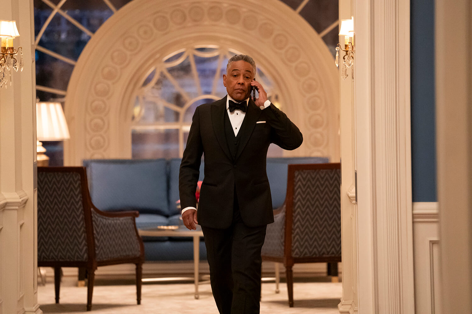 AB walking down the hallway on his phone in The Residence.