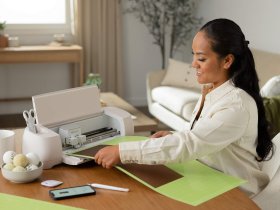 A woman with the Cricut Explore 4