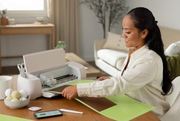 A woman with the Cricut Explore 4
