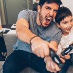 A man and his son gaming.