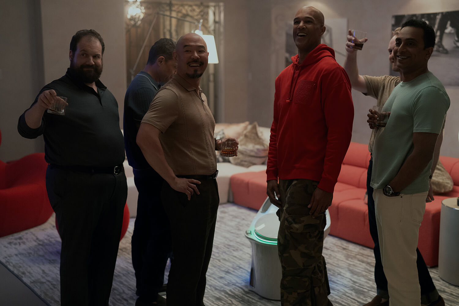 A group of men hanging out at a party in Your Friends and Neighbors.