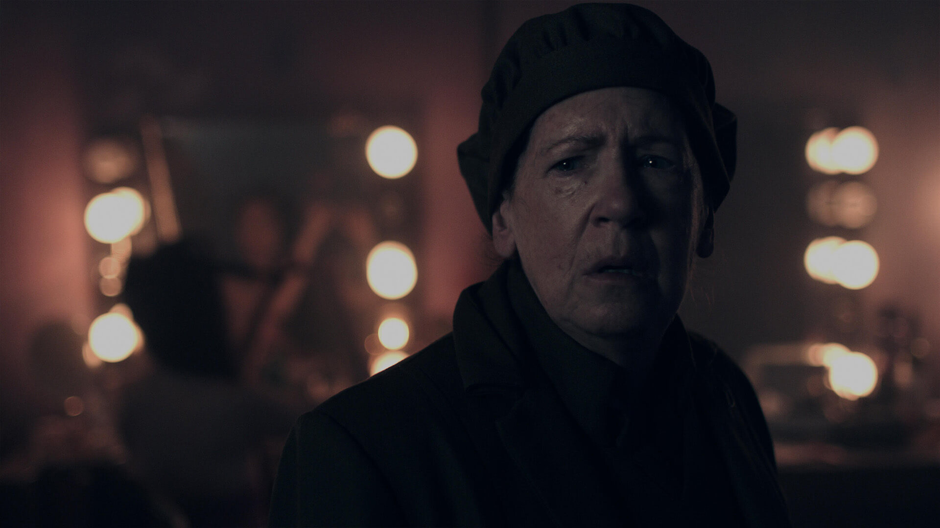 Aunt Lydia looking shocked in The Handmaid's Tale.