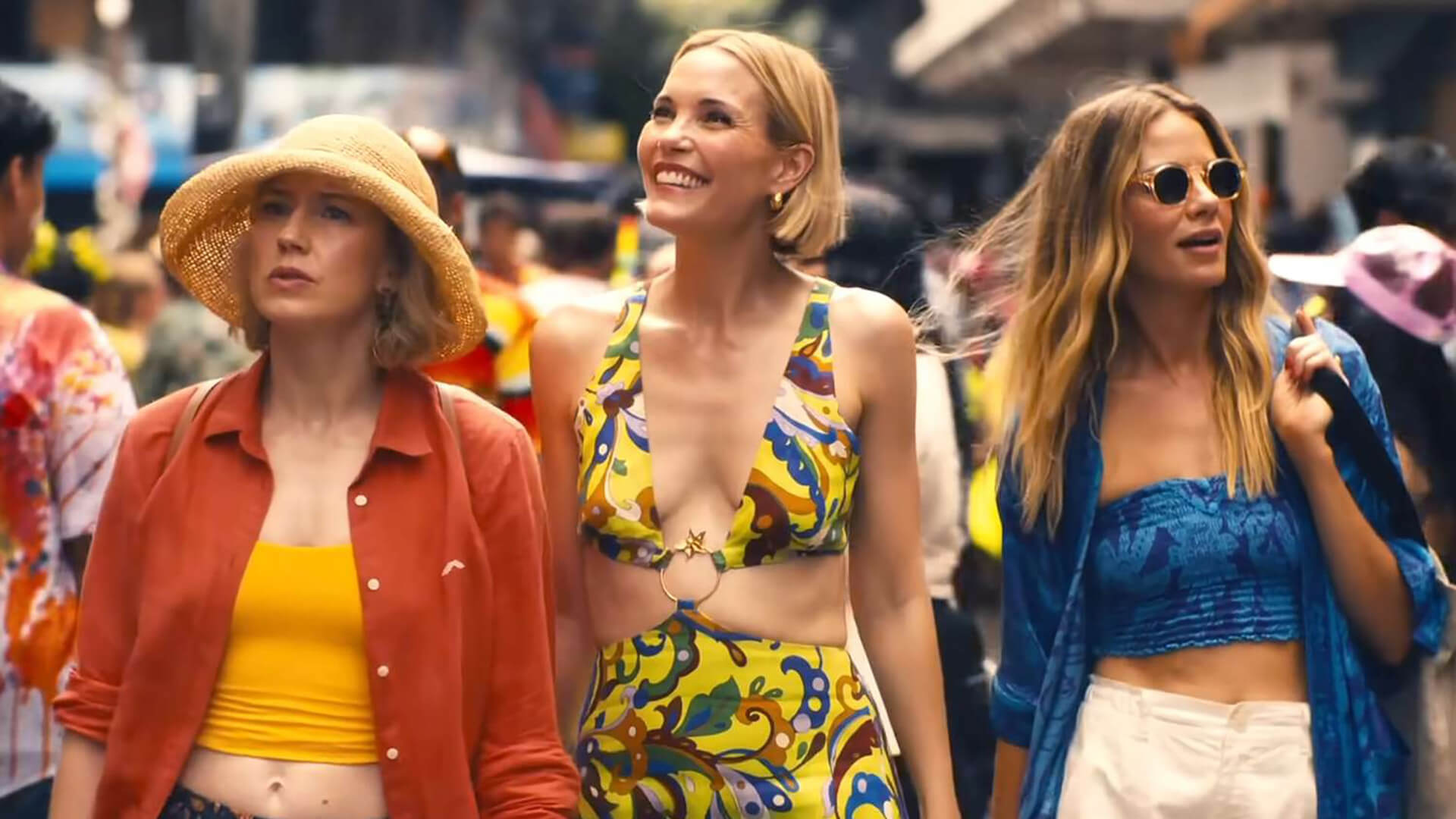 Laurie, Kate, and Jaclyn walking the streets of Thailand on The White Lotus.