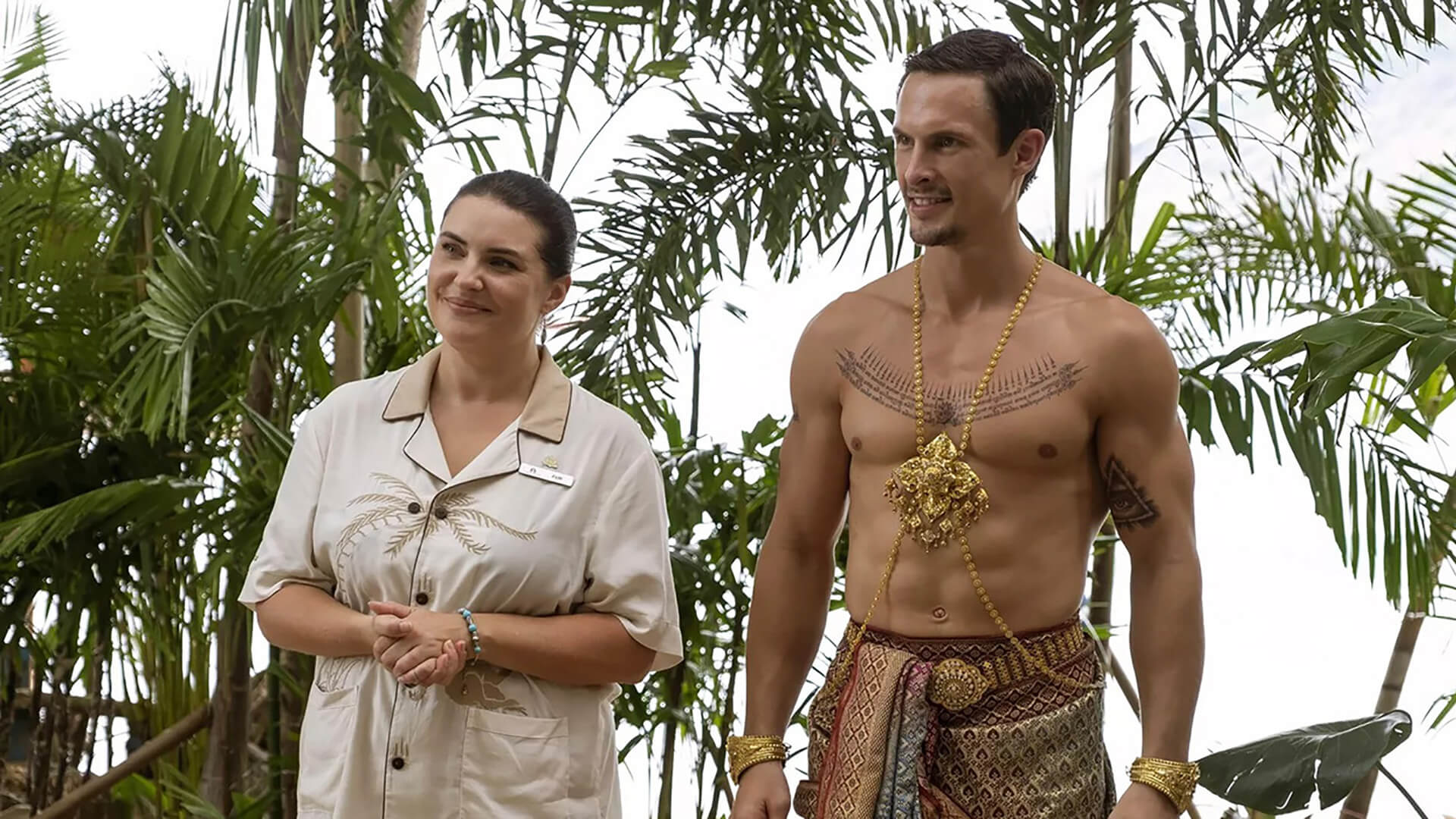 Valentin with another employee dressed with no shirt in The White Lotus.