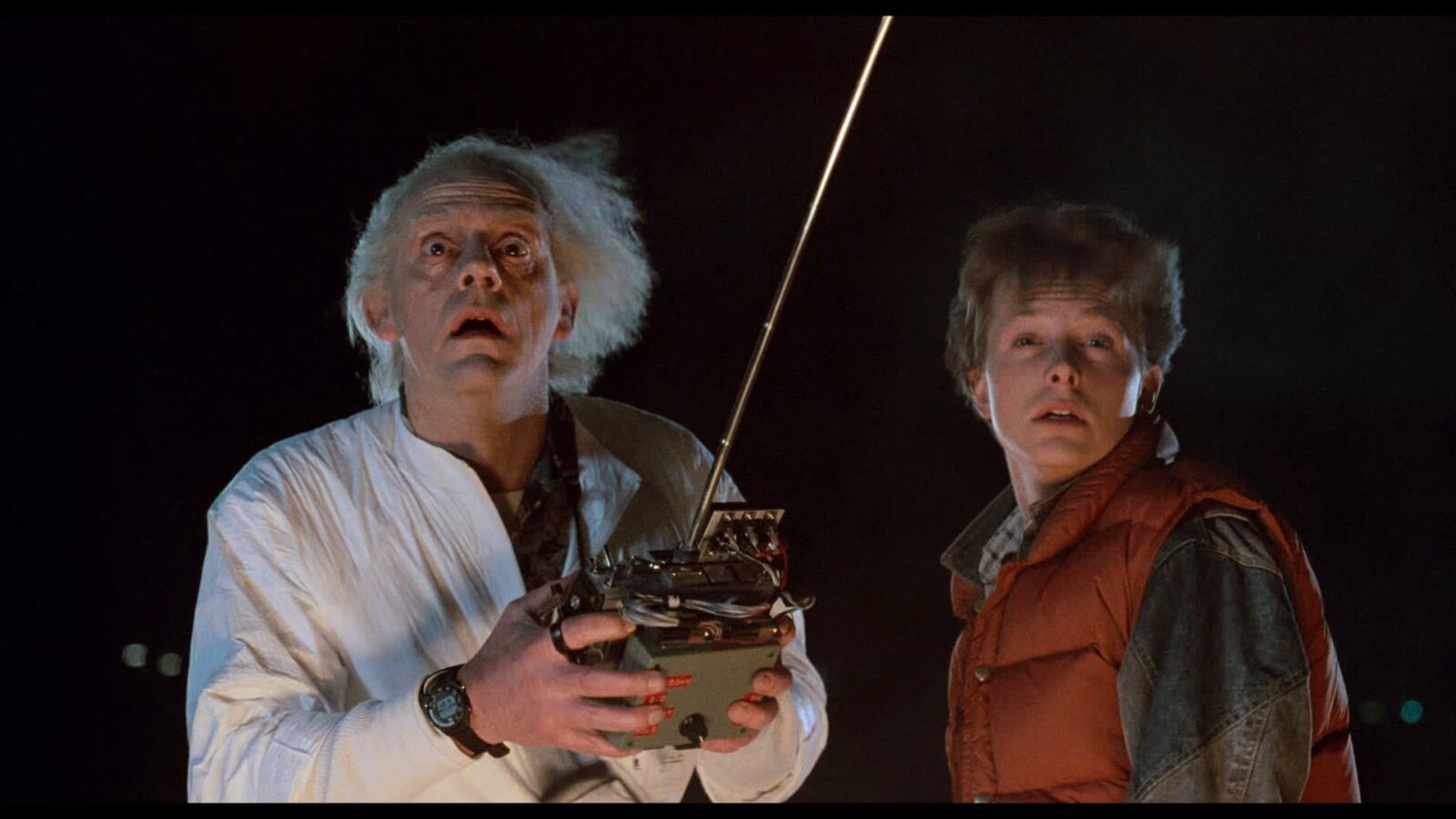 Doc and Marty looking up to the sky in the dark in Back to the Future.