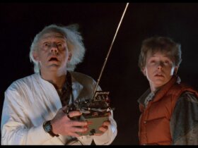 Doc and Marty looking up to the sky in the dark in Back to the Future.