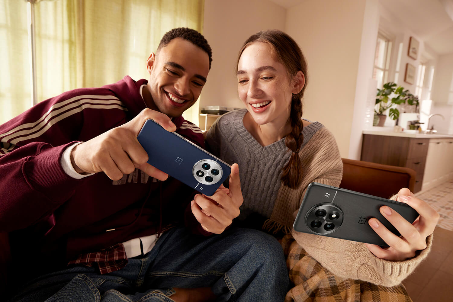 Two young people with OnePlus 13 phones