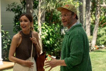 Sylvia and Will smiling at someone in Platonic season 2.