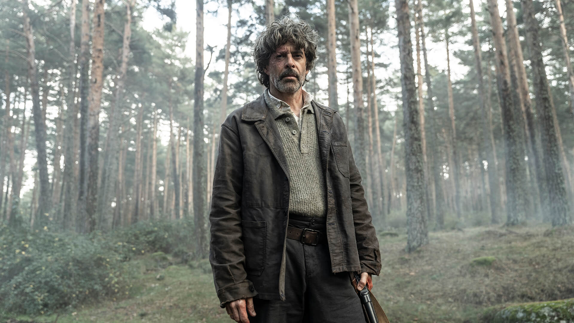 A man standing in the forest in The Walking Dead: Daryl Dixon.