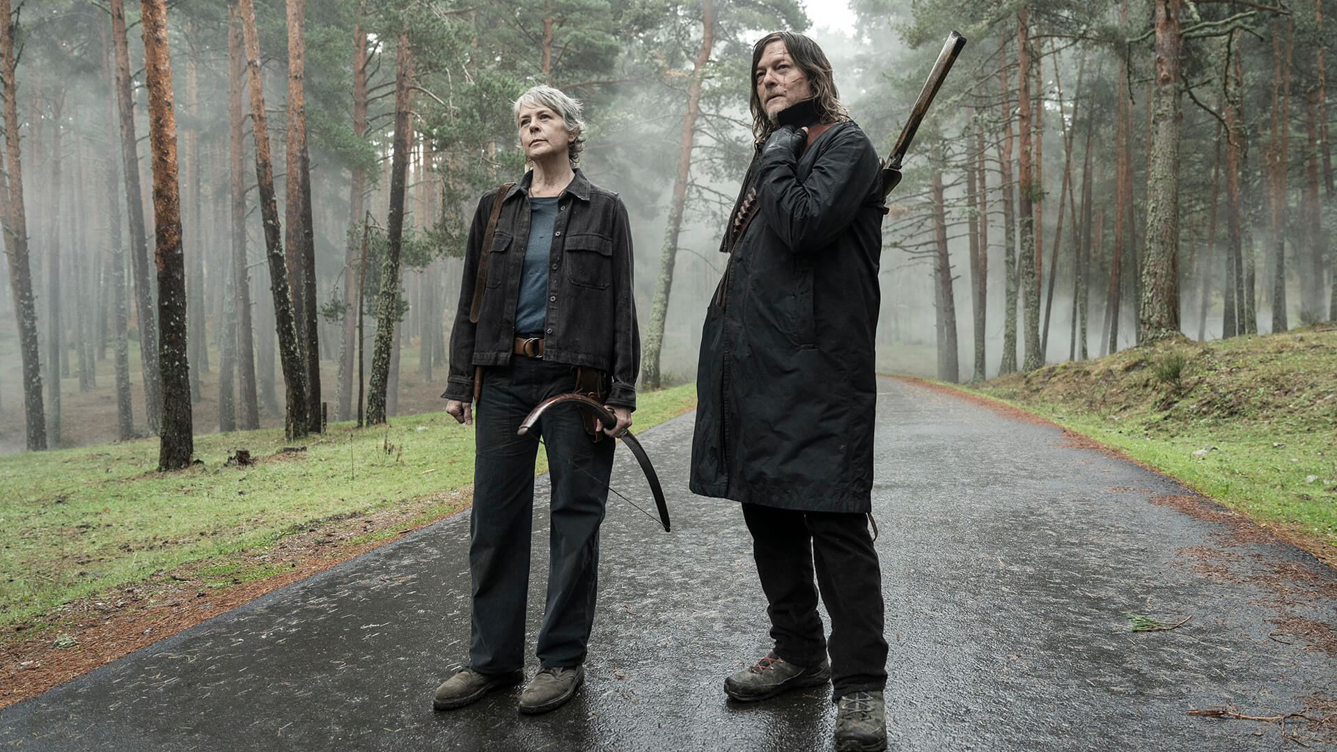 Carol and Daryl standing together on the road in The Walking Dead: Daryl Dixon.