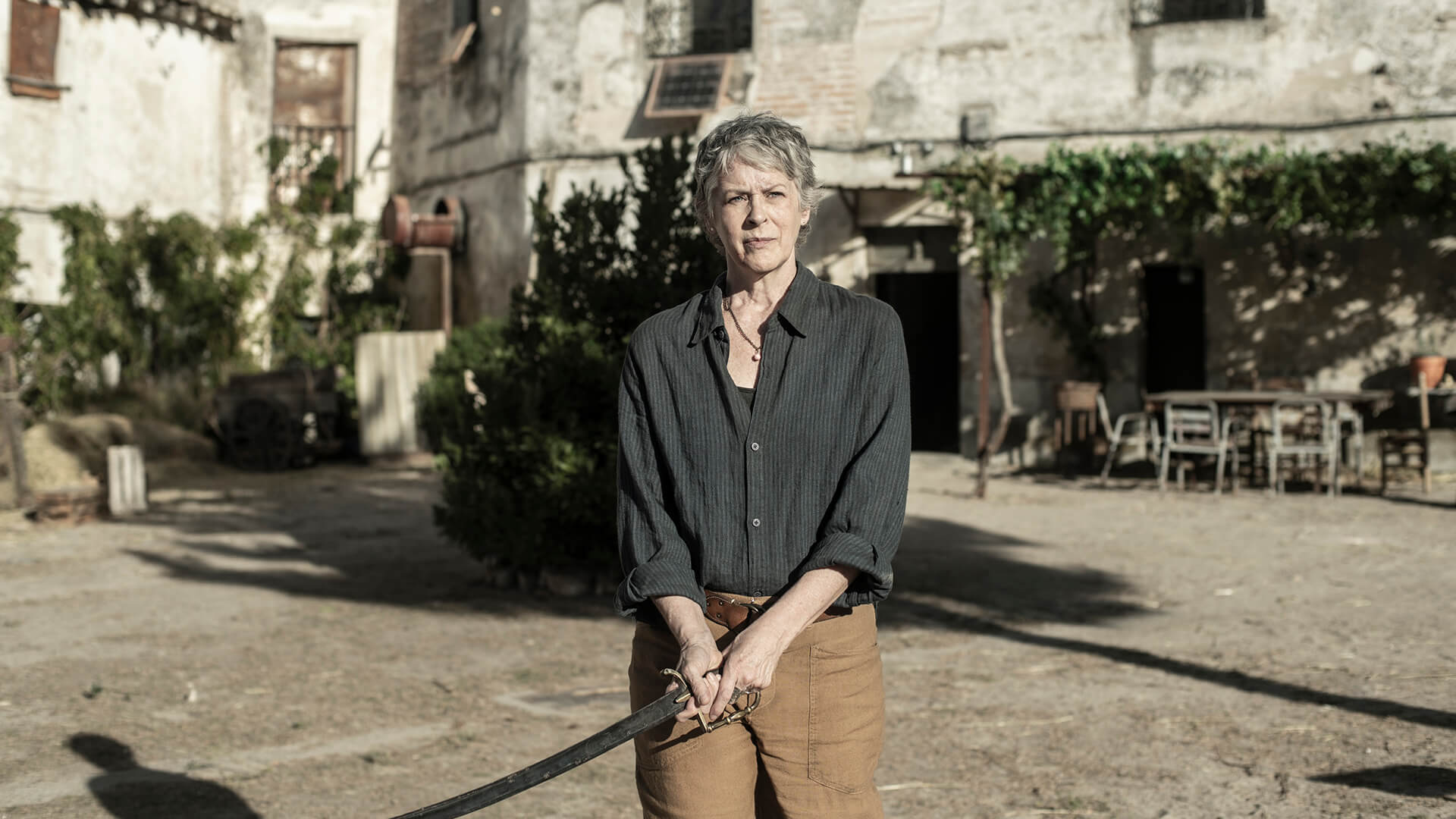 Carol standing with a sword in The Walking Dead: Daryl Dixon.