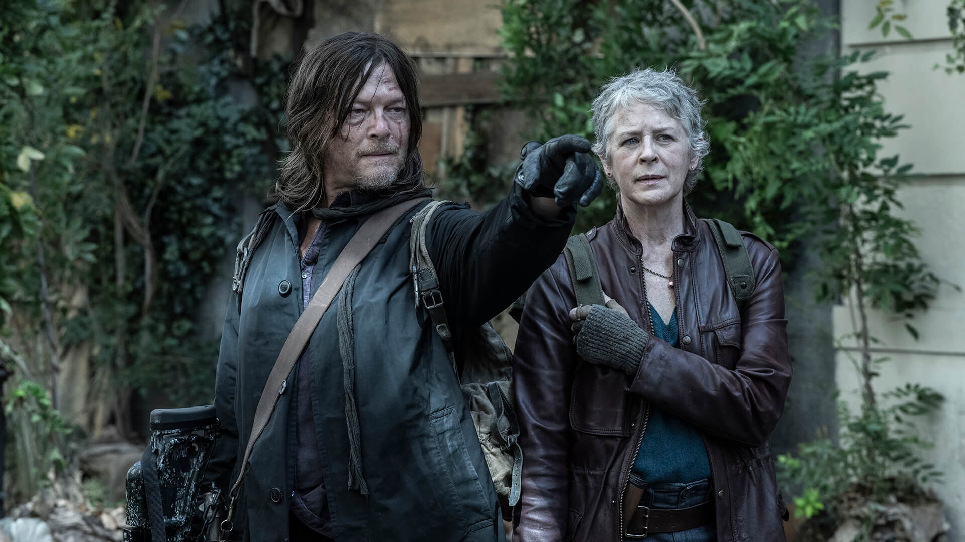 Daryl pointing while standing with Carol in The Walking Dead: Daryl Dixon.