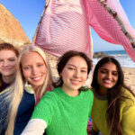 A group taking a selfie with an iPhone 17