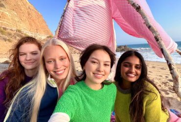 A group taking a selfie with an iPhone 17
