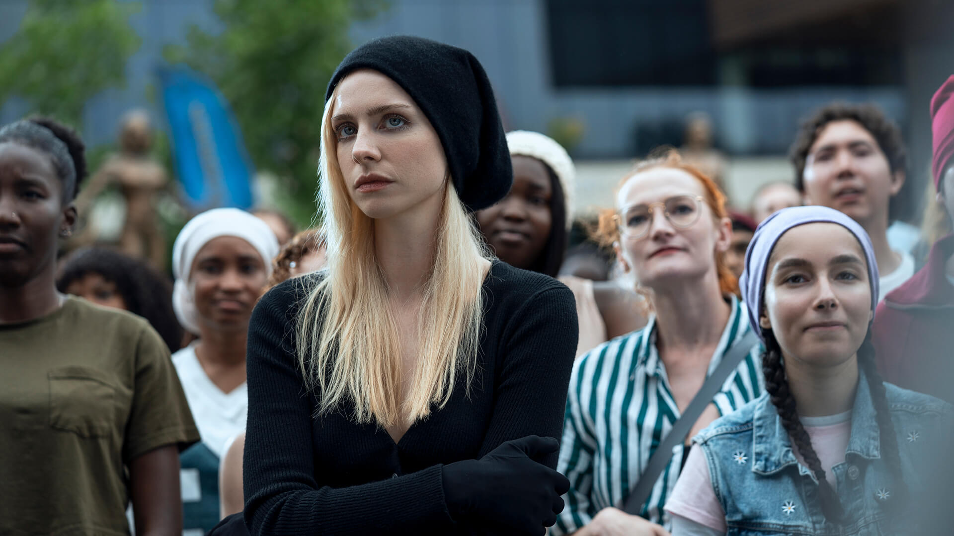 Cate standing in a crowd in Gen V.