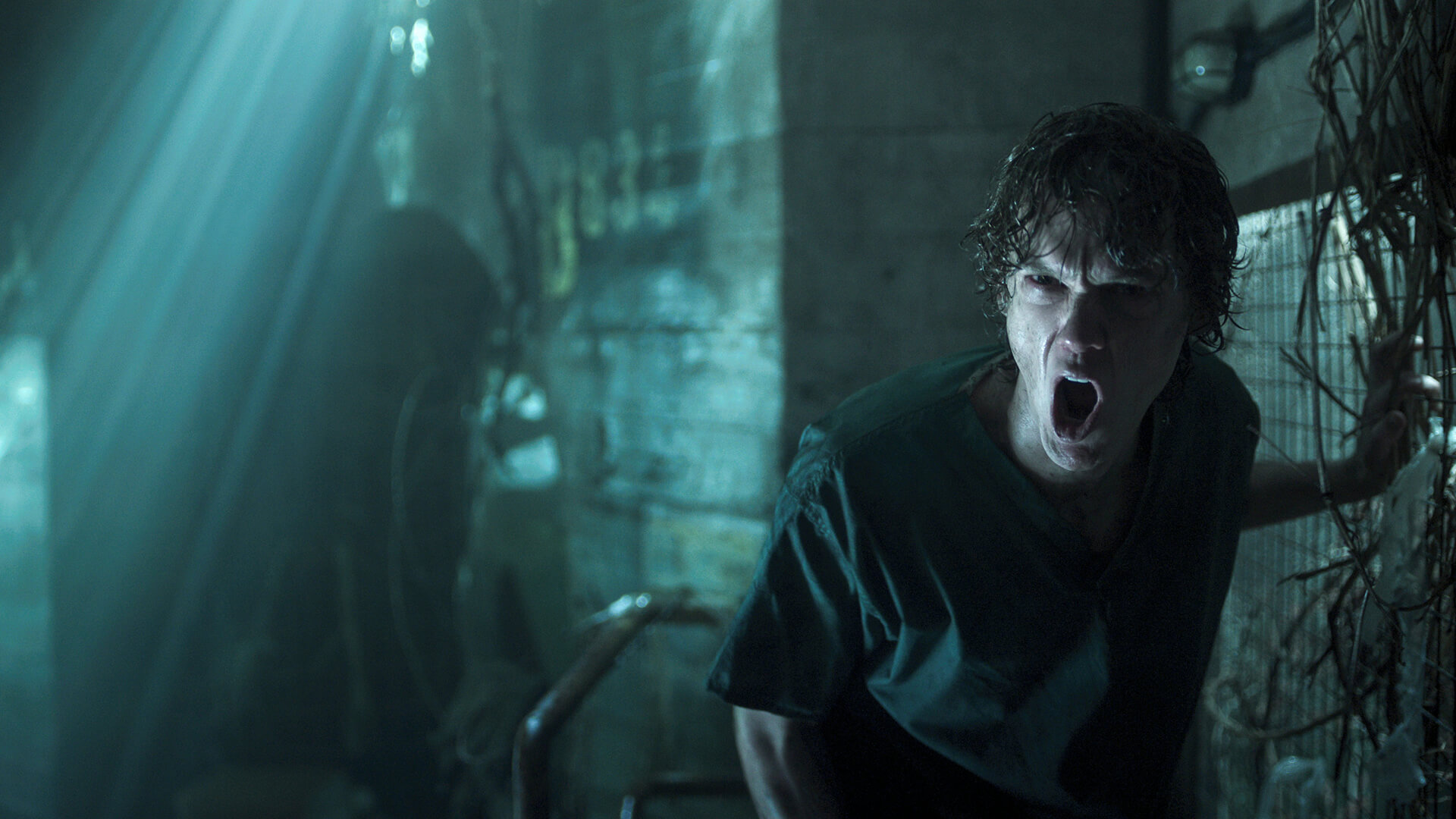 Tyler in a dark basement screaming in Wednesday.