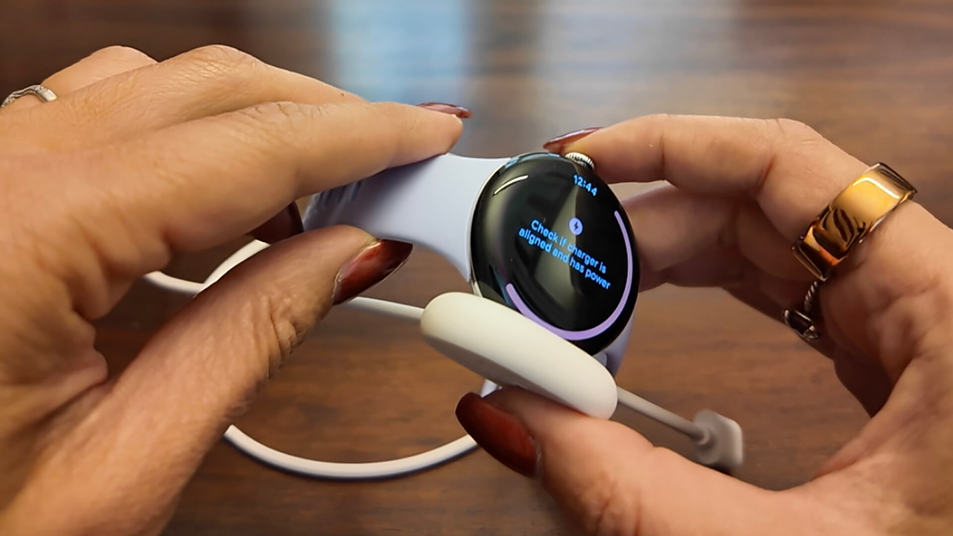Google Pixel Watch 4 on its charger
