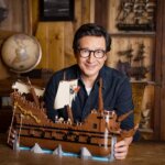 Ke Huy Quan with The Goonies Lego set.