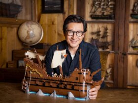 Ke Huy Quan with The Goonies Lego set.