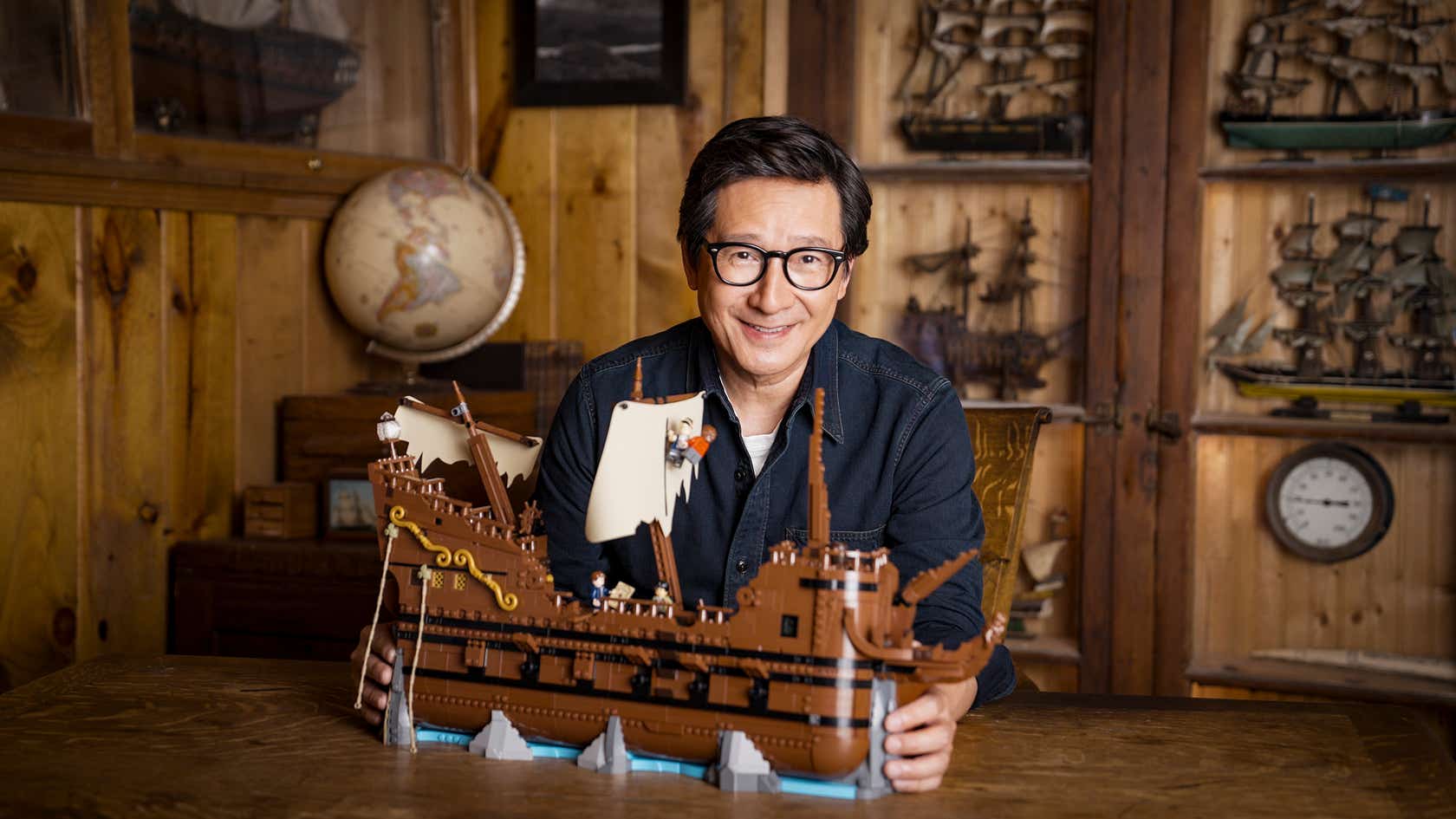 Ke Huy Quan with The Goonies Lego set.