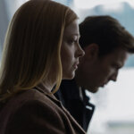 A woman and man looking upset in side profiles in All Her Fault.