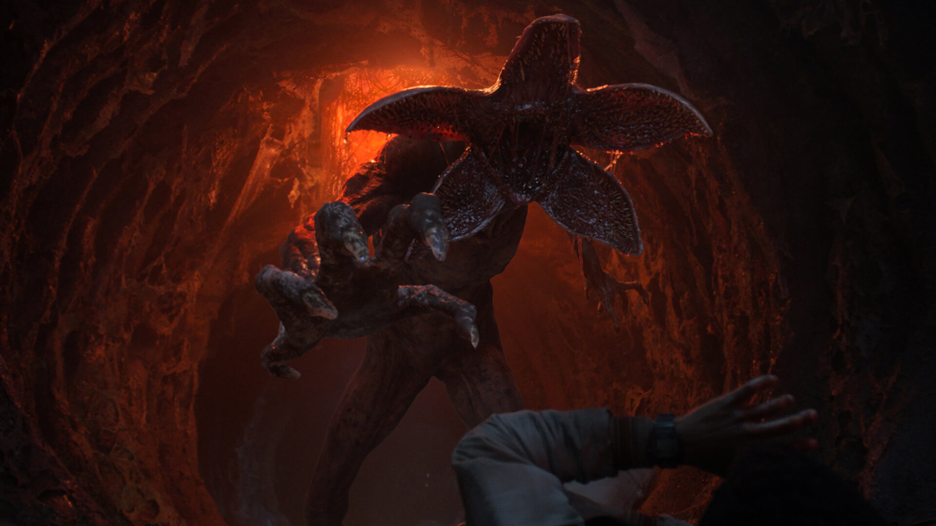 A Demogorgon attacking someone in a cave in Stranger Things.