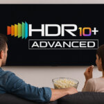 Two people watching TV with the HDR10+ Advanced logo.
