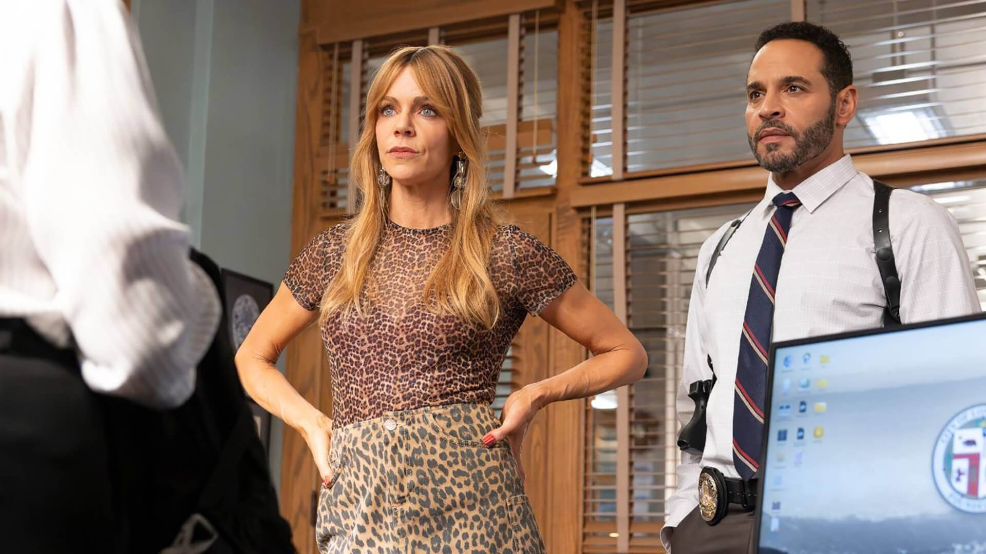 Morgan with her hands on her hips, Karadec beside her in High Potential.