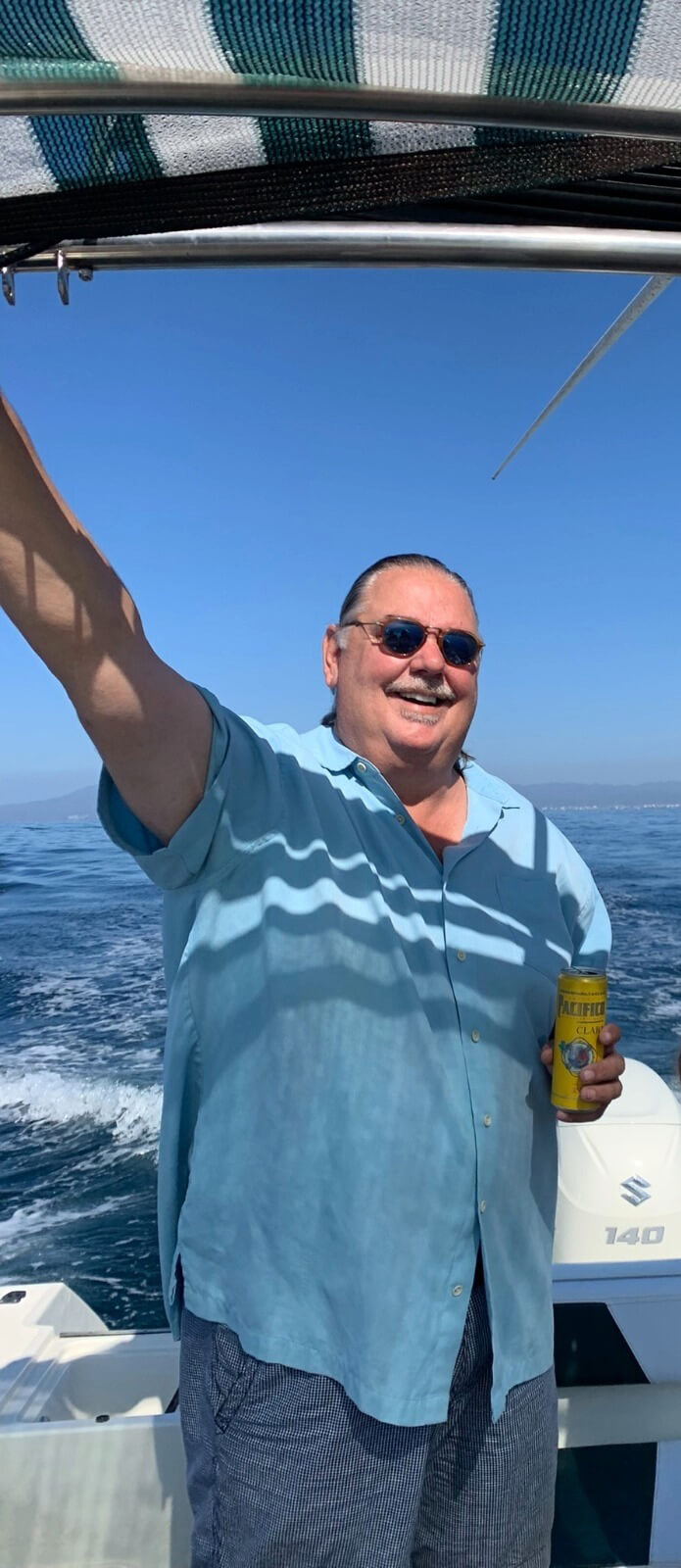 George Finlayson looking happy on a boat