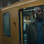 Sam outside of a train car in Hijack.