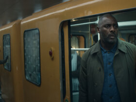 Sam outside of a train car in Hijack.