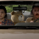 Matty in the car with John and Ted in Ted.