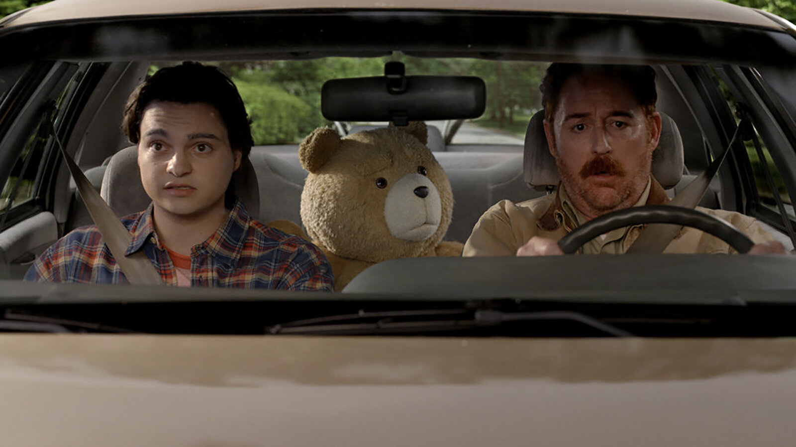 Matty in the car with John and Ted in Ted.