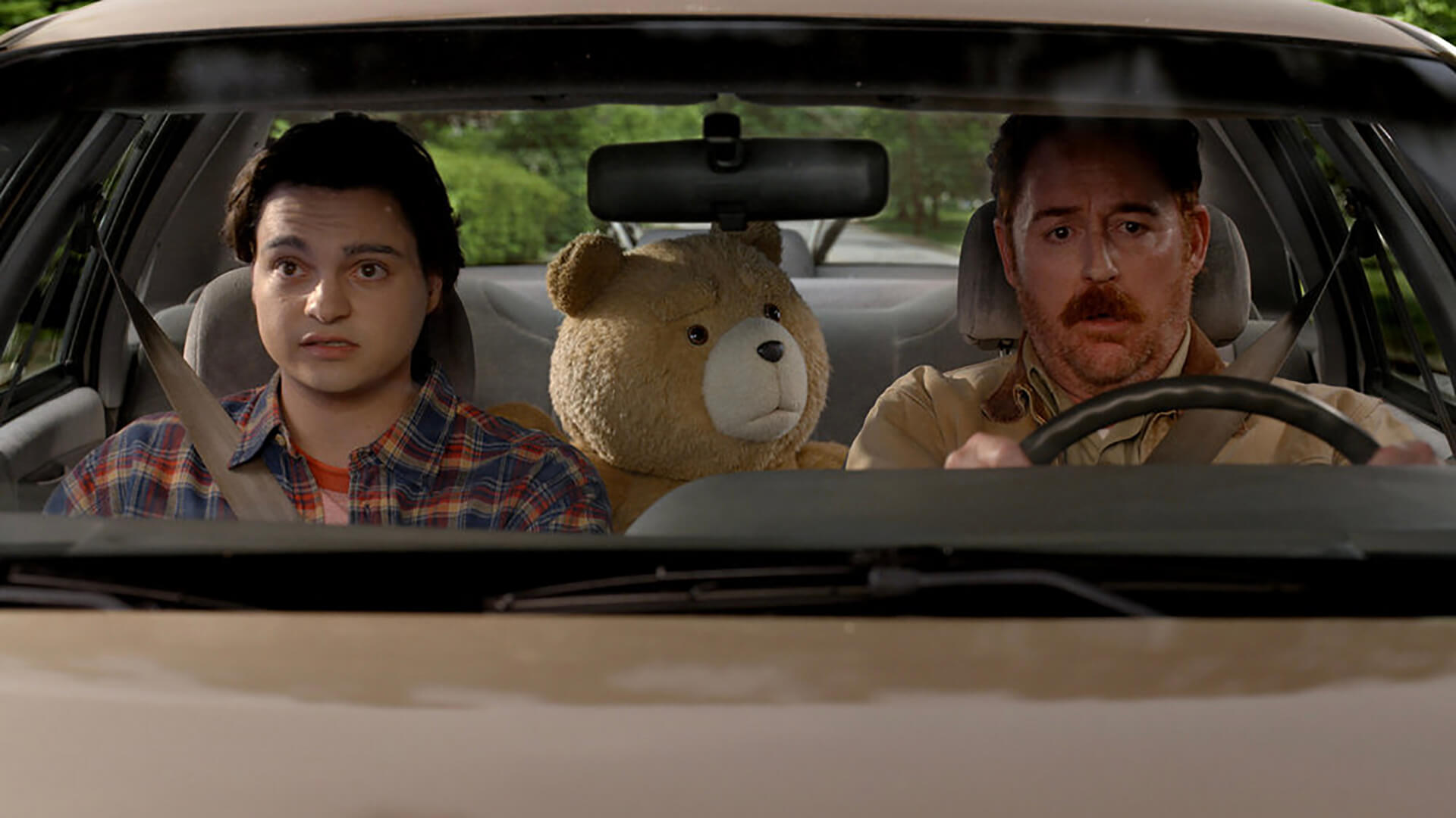 Matty in the car with John and Ted in Ted.