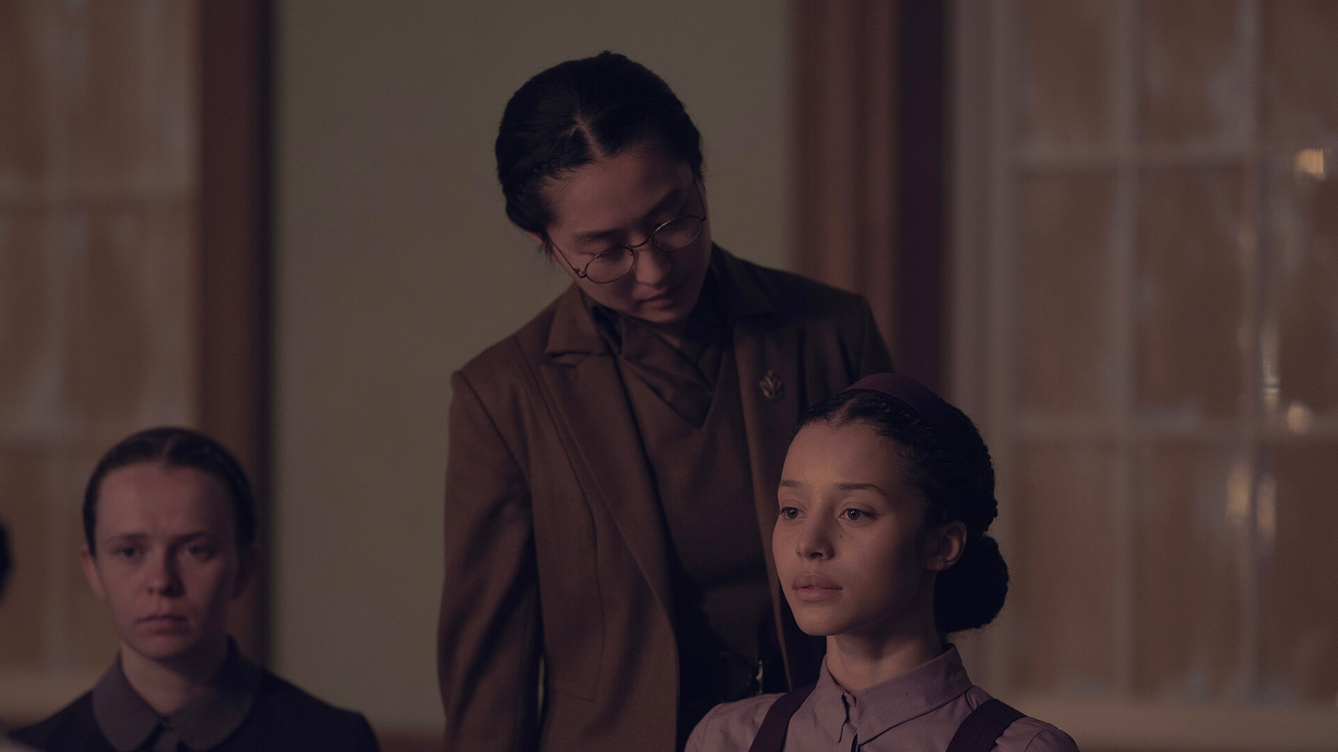 Aunt Vidala looking down at Agnes in The Testaments.