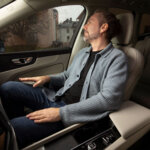 Man in car with Dirac Spaces