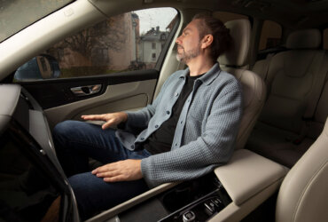 Man in car with Dirac Spaces