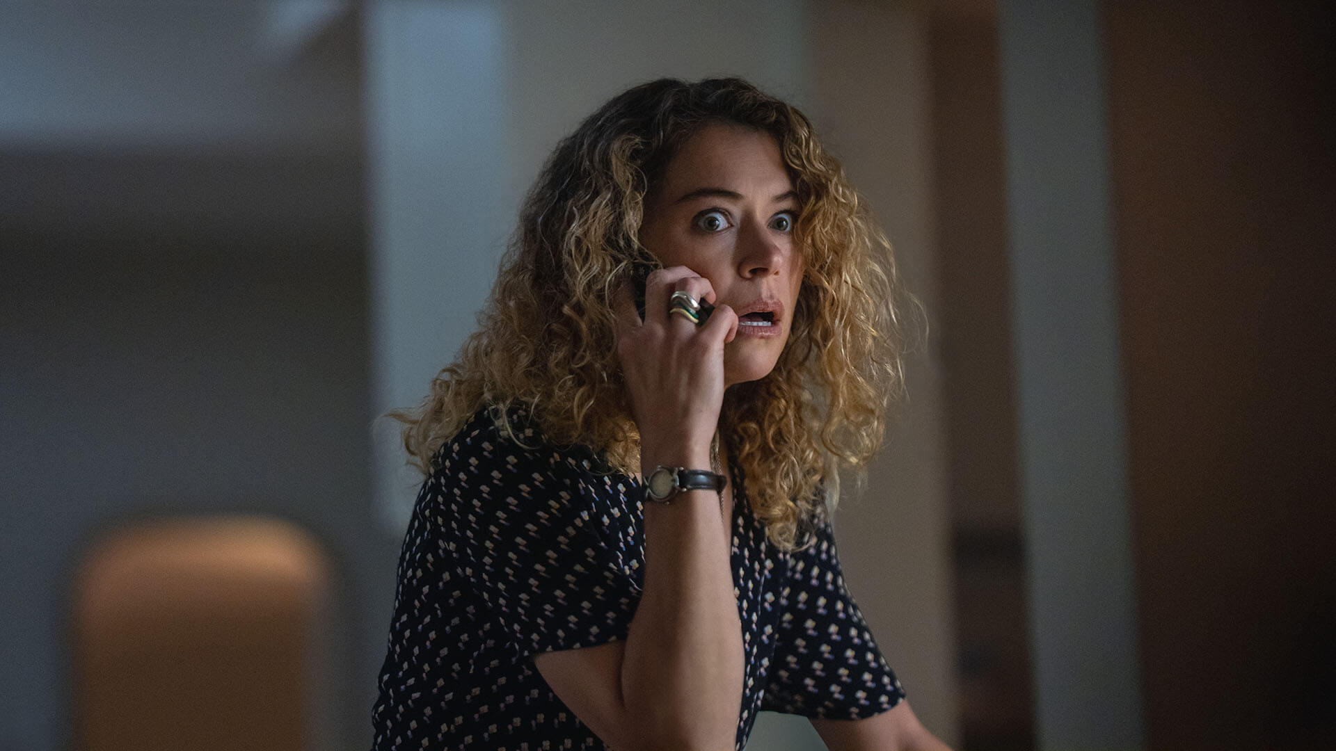 Paula on the phone looking shocked in Maximum Pleasure Guaranteed.