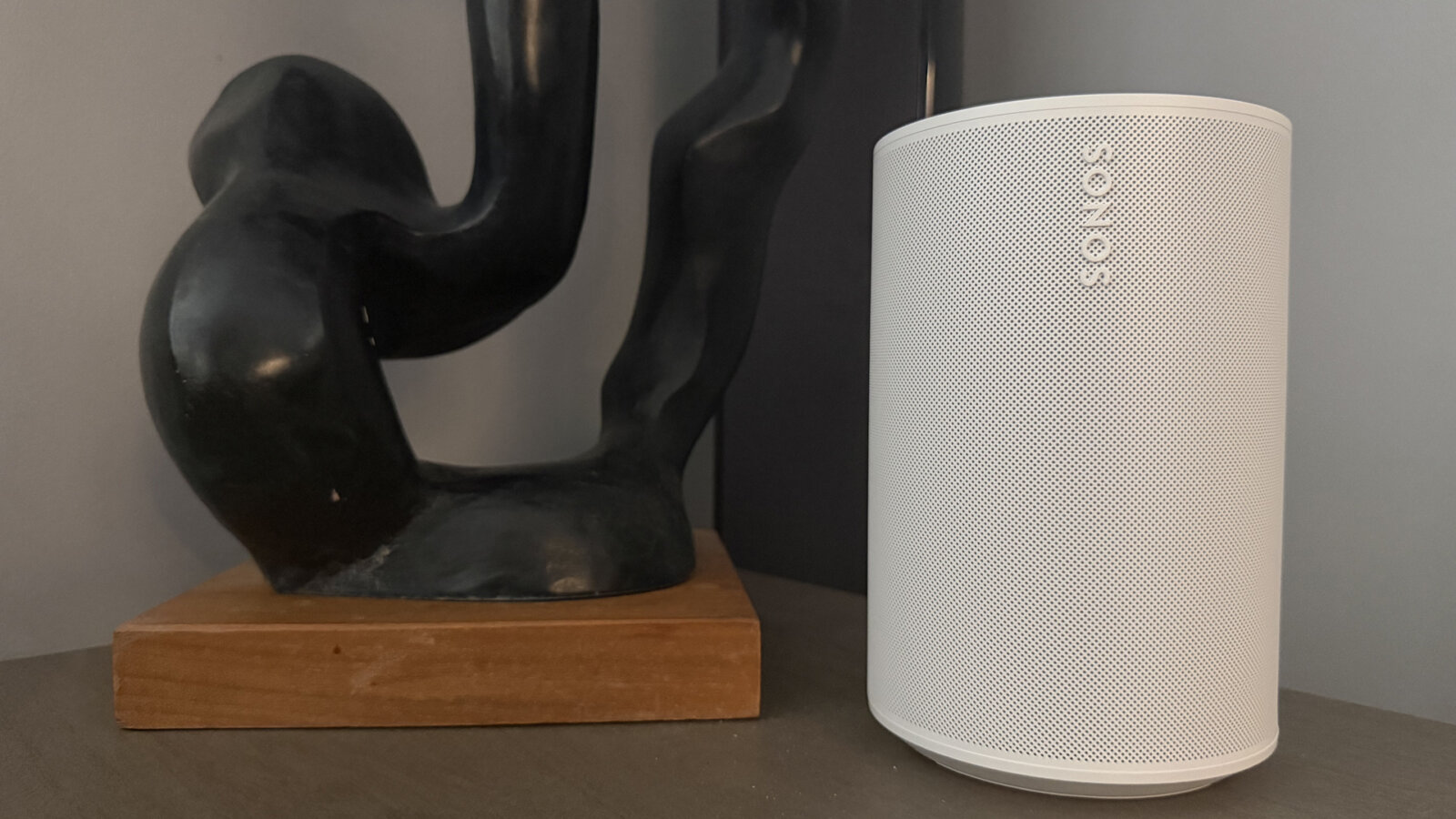 Sonos Era 100 SL on a side table.