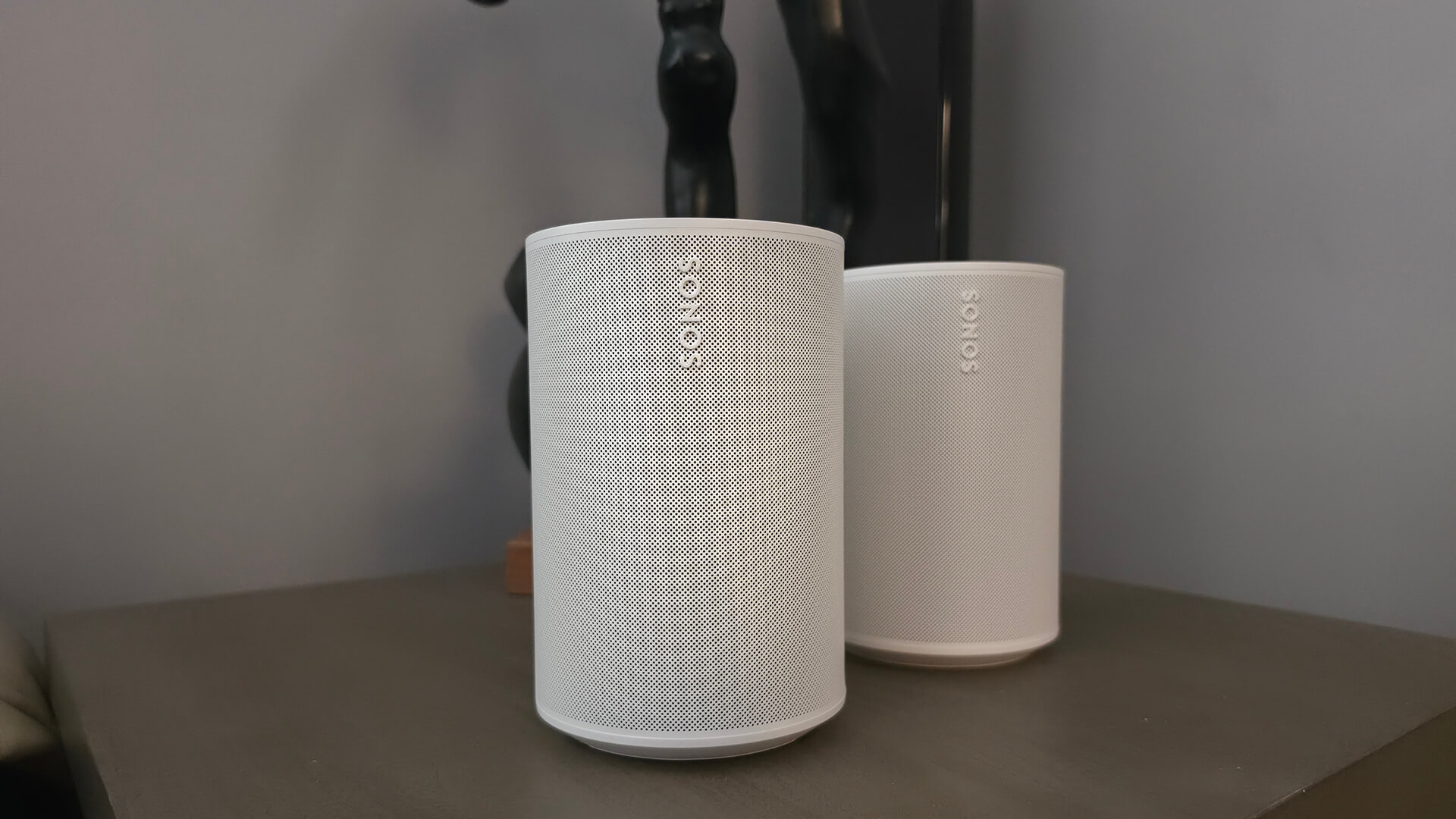 Sonos Era 100 SL with the Sonos Era 100 behind it.