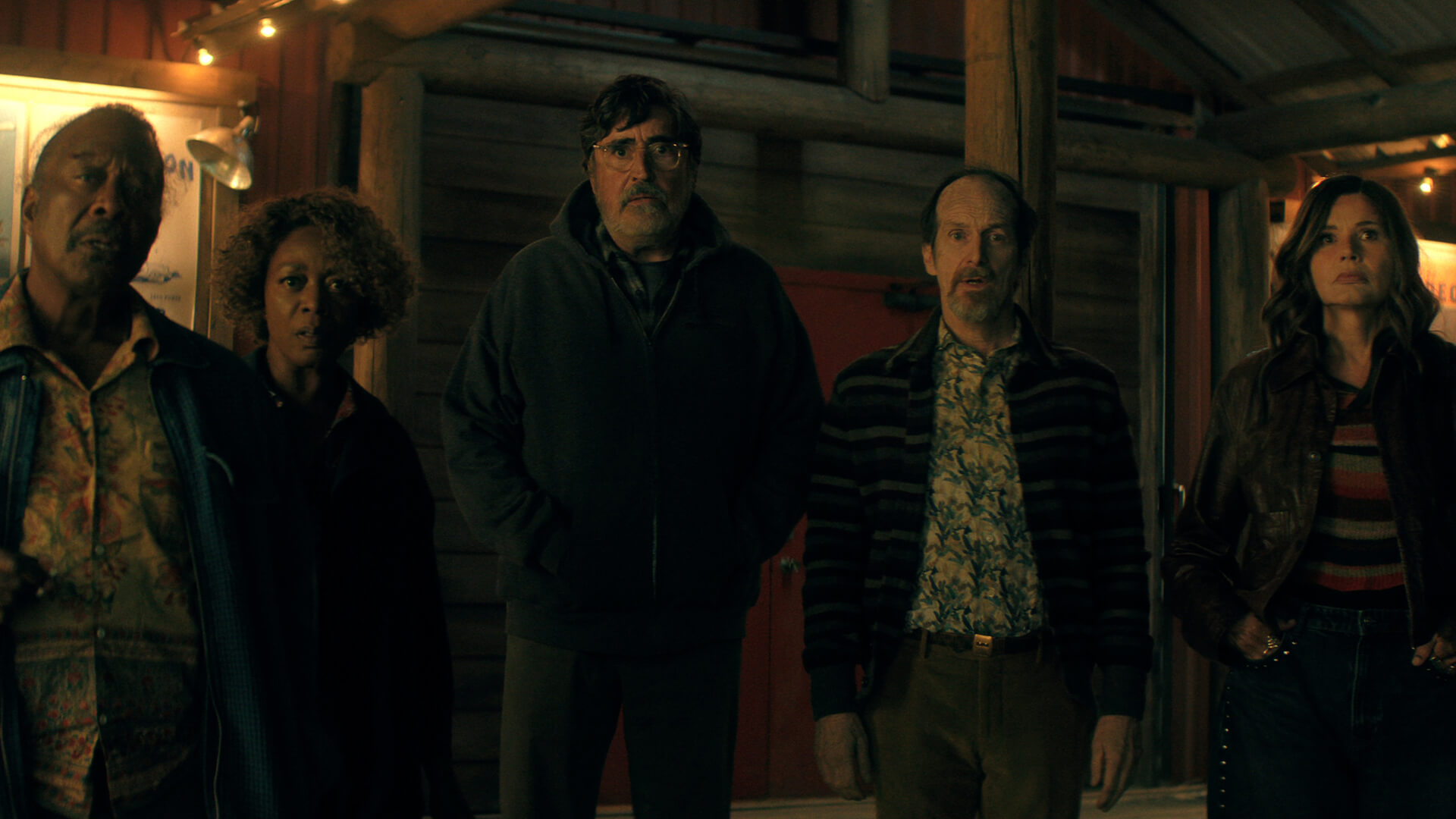 The five main characters in The Boroughs standing outside in the dark.